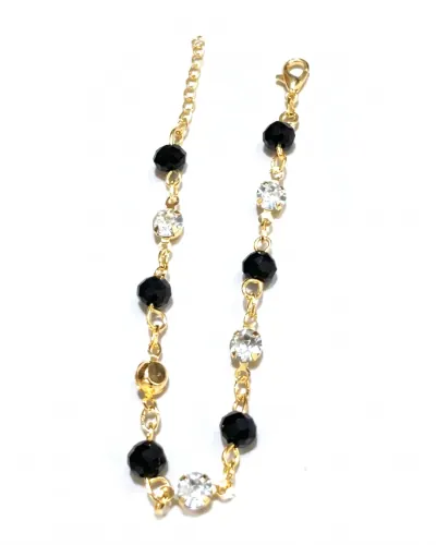 Pulseira dourada com cristais pretos